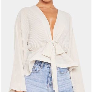 Nude chiffon pleated flounced hem blouse